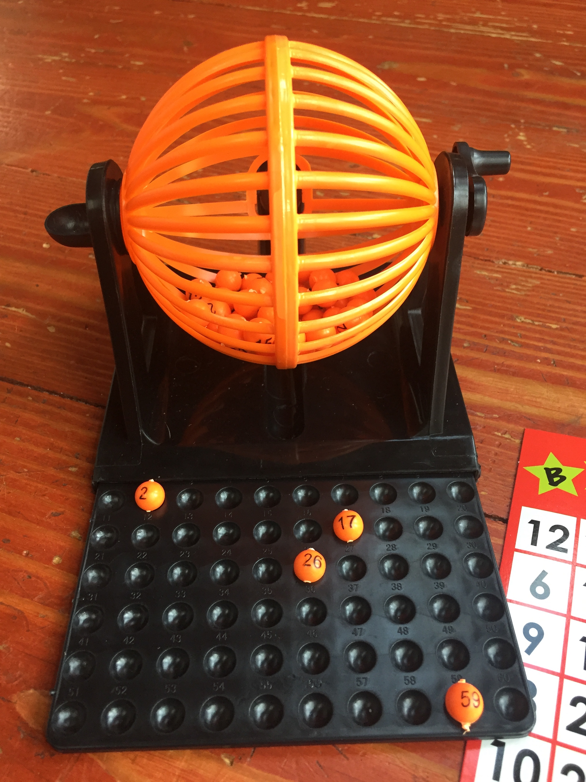 Mini bingo set with cage and tiny orange balls