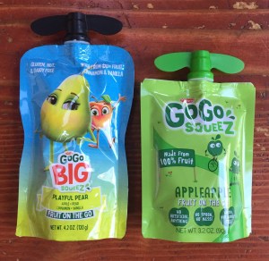 GoGo Big Squeez pear fruit pouch next to GoGo Squeez applesauce pouch 3.2 oz