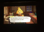 Asus Zenbeam E1 mini pocket projector projecting Animal Crossing Nintendo Switch game onto blinds