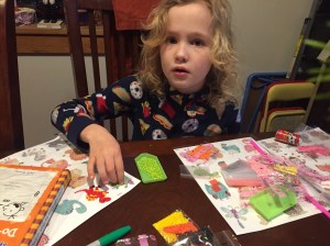 Child working on art project diamond painting