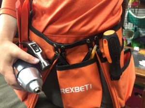 Child wearing Rexbeti kids tool belt 15 piece set orange