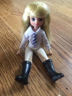 Lottie Dolls Pony Pals Olivia doll in riding clothes and boots sitting down