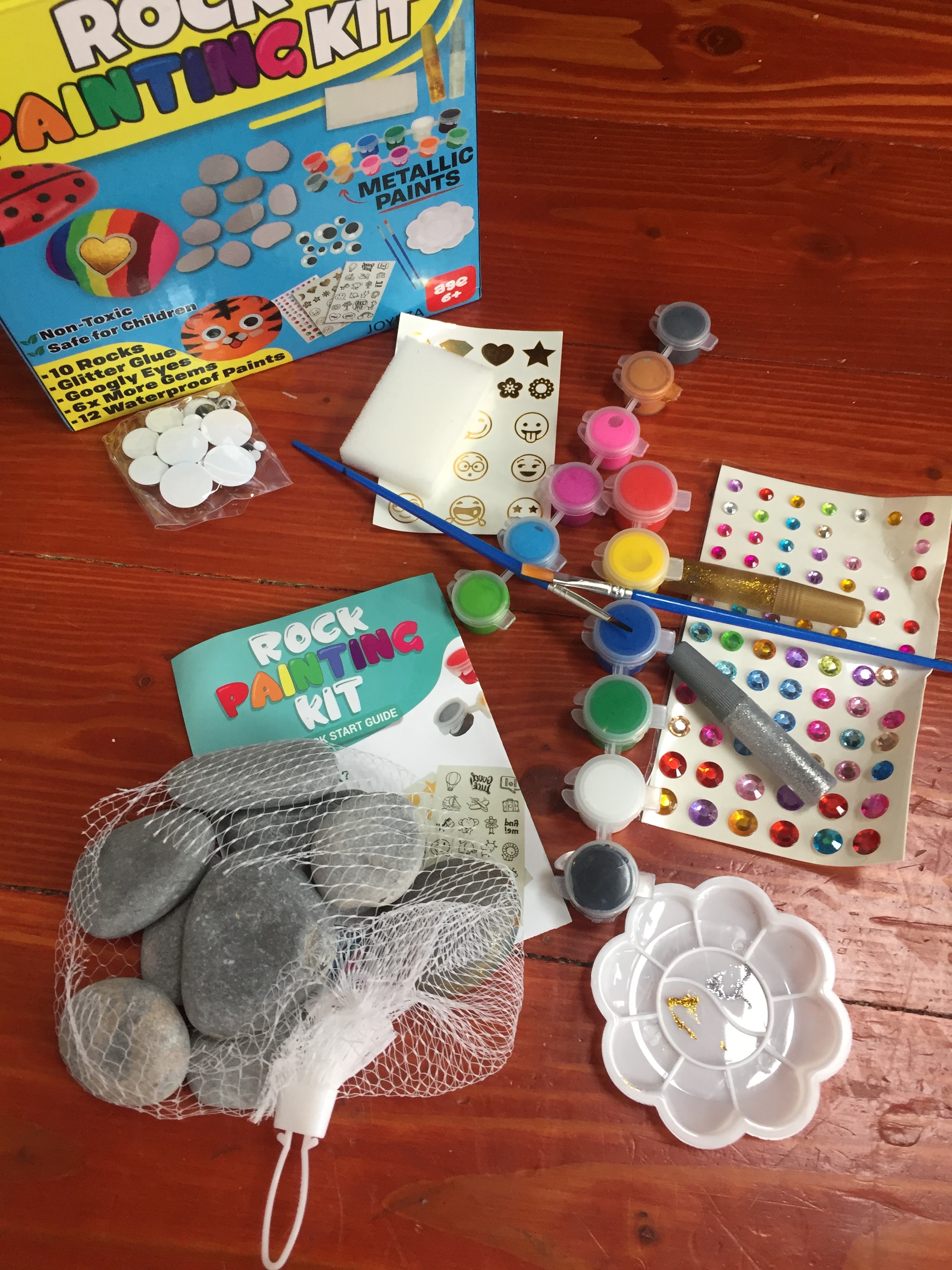 Joyeza rock painting kit contents rocks paint paintbrushes glitter glue gems googly eyes paint palette sponge and more
