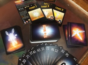The Mind card game by Pandasaurus life cards and throwing stars next to deck