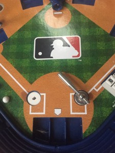 Slammin' Sluggers baseball game home plate with bat and strike zone