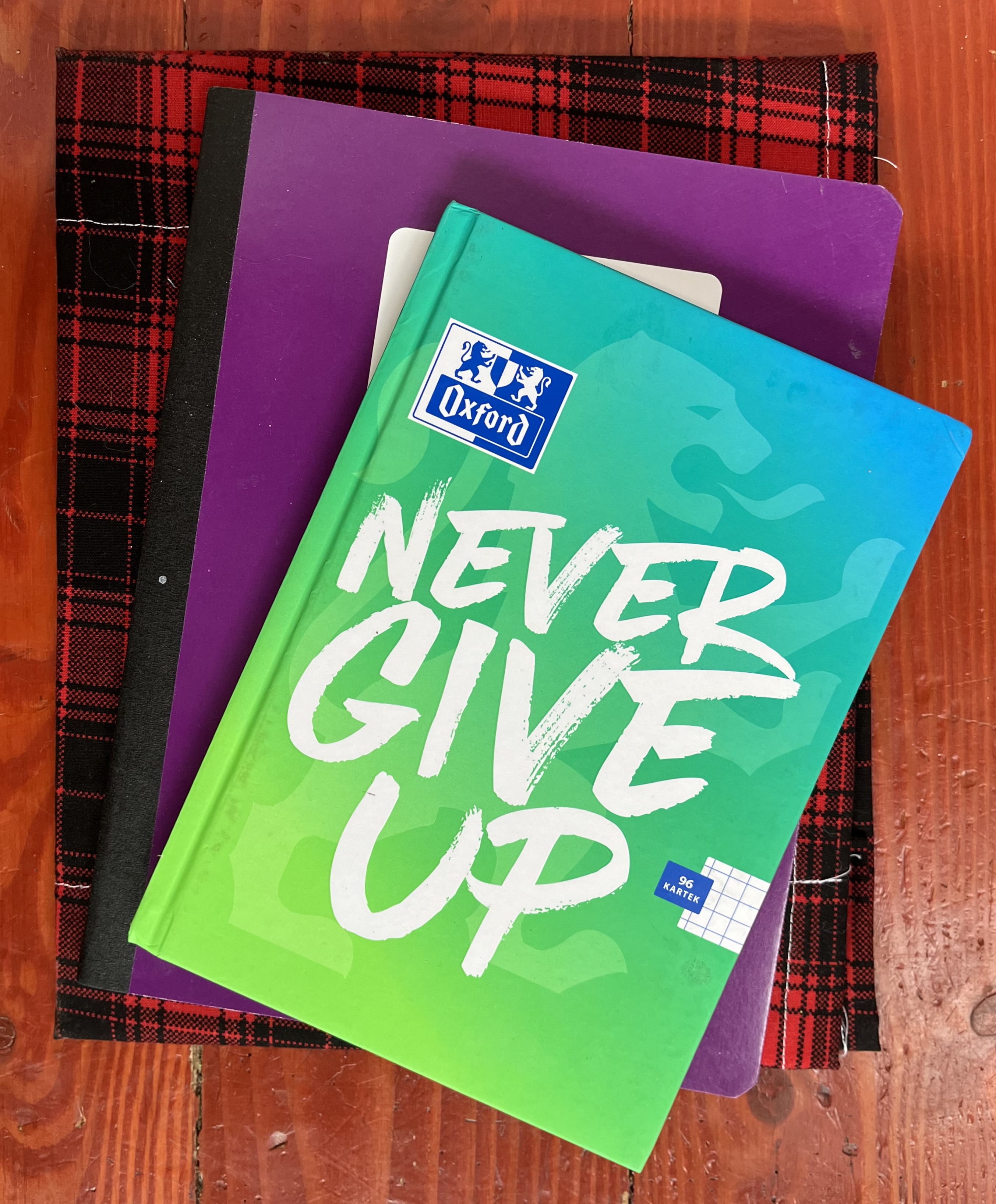 Graph paper notebooks in small, regular, and decorated with plaid cloth cover in a stack