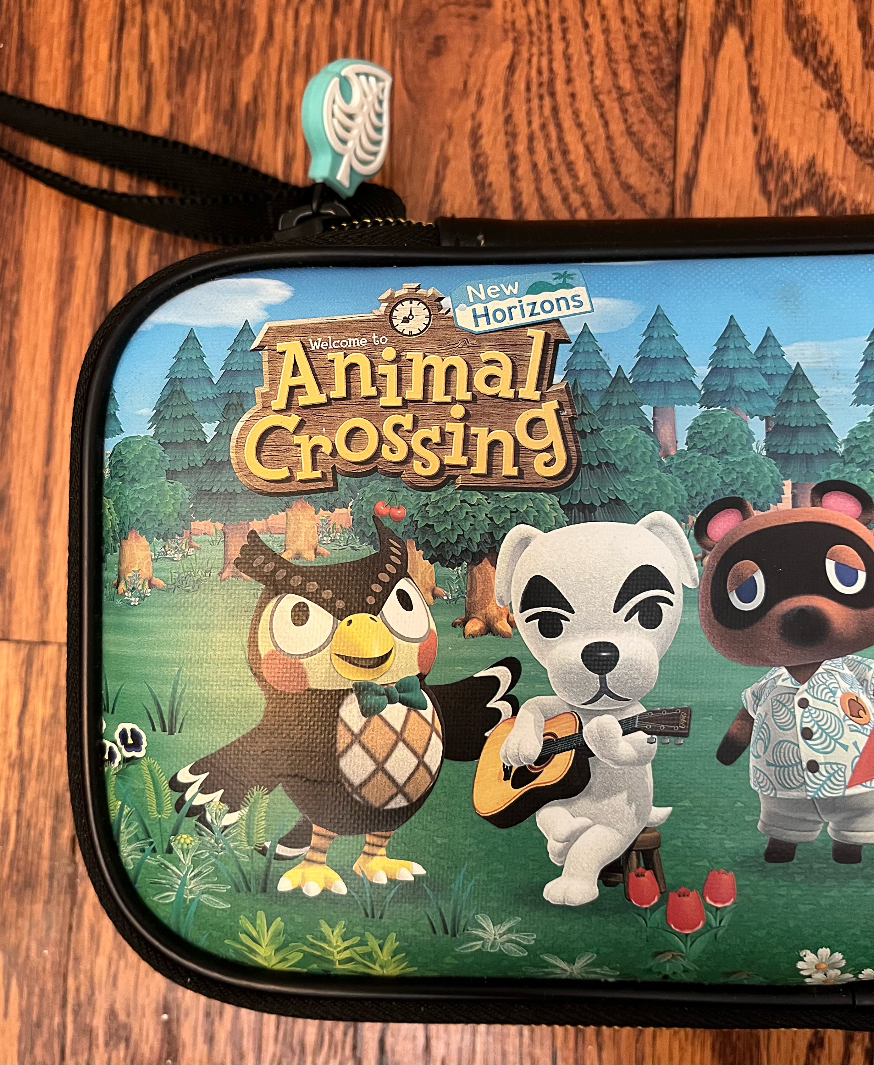 Animal Crossing Nintendo Switch case cover with Blathers the owl and K.K. Slider singer dog and Tom Nook