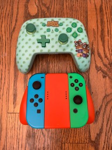 Animal Crossing and regular Nintendo Switch controllers side by side
