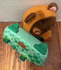 Top of Animal Crossing Nintendo Switch controller next to Timmy