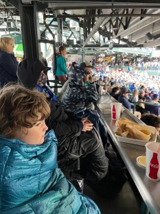 Eleven year old boy at baseball game using camouflage Obuby