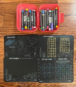 Chalkboard crayons in travel soap dish case and small travel sized chalkboard mats with activites