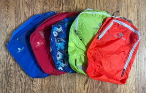 Eagle Creek Pack-It Cubes in rainbow of colors orange green blue floral red and blue cubes fanned