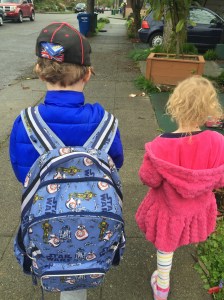 Pottery Barn Kids' Backpack Star Wars print with BB8 child wearing while walking on sidewalk