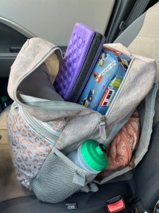 IMG kids backpack from Target with Wildkns lunch box, water bottle, sit pad, and more inside