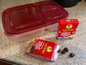SunMaid chocolate and vanilla yogurt covered raisins snack boxes next to EasyLunchBox