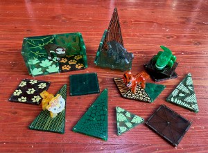 Magna-Tiles Jungle Animal Set pieces with printed designs and leopard, tiger, caiman, hippo, and sloth