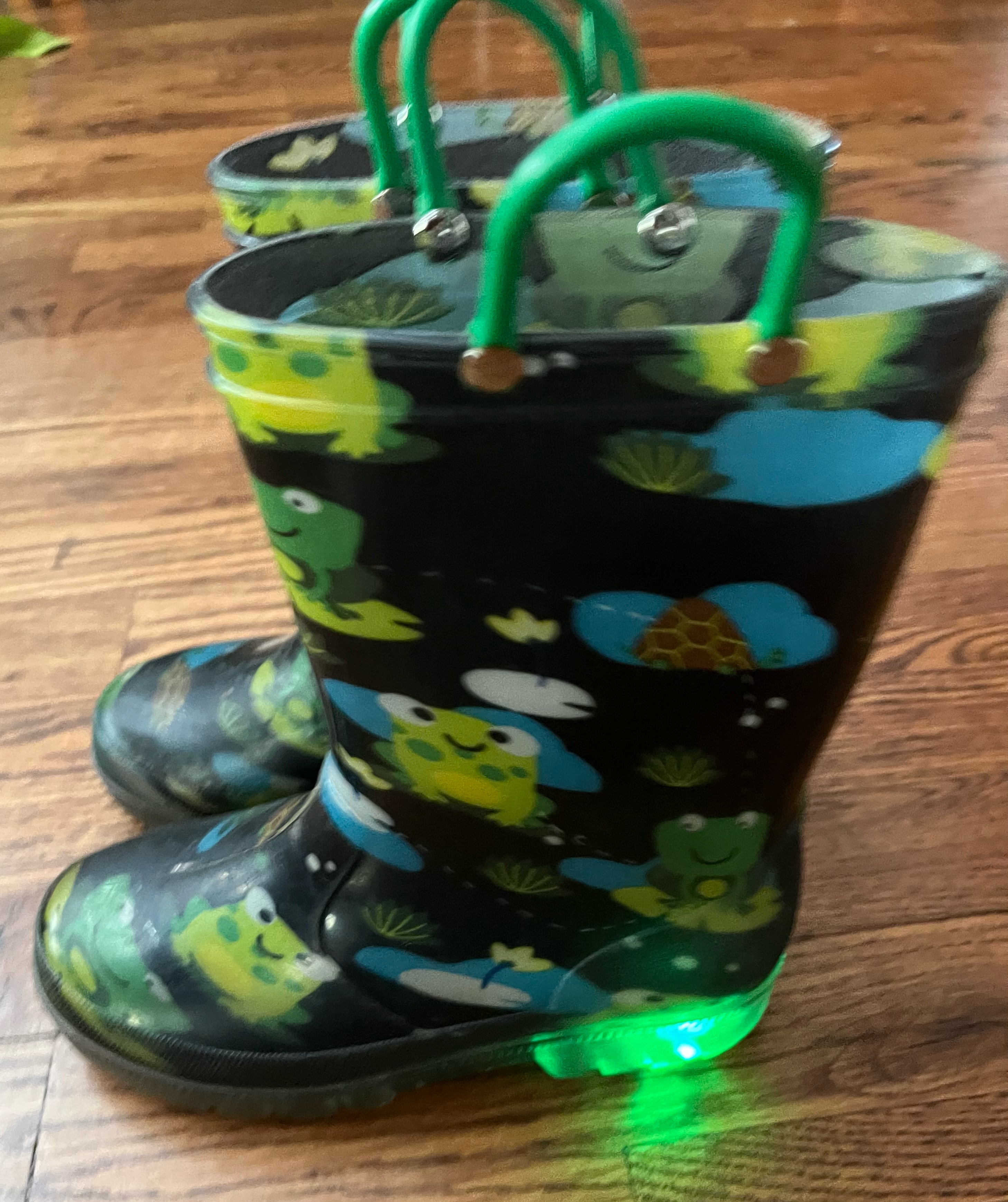 Outee Kids Light Up Rain Boots with flashing green heels on frog print with navy background