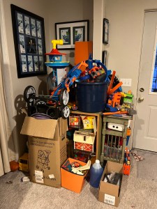 Pile of toys and junk in corner of basement