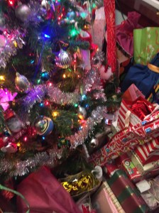 Wrapped presents under decorated Christmas tree