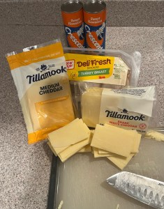 Ingredients on counter for Croissandwiches Pillsbury crescent rolls, Tillamook cheddar cheese, Oscar Meyer turkey