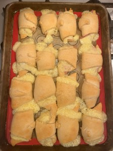 Pillsbury crescent rolls with cheese, ham, and turkey rolled into them before cooking
