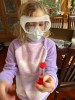 Ten year old girl using Science Academy Bubble, Fizz, and Foam Ultimate Chemistry Lab from MindWare