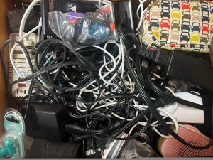 Messy disorganized electronics cord drawer