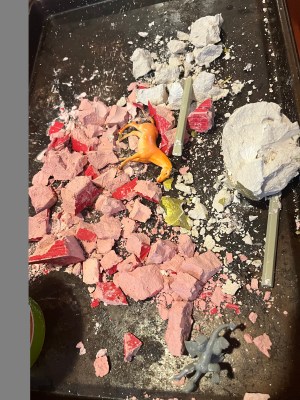 Dig It Up! Discoveries Farm Animals and Dragon Egg from MindWare mess on cookie sheet