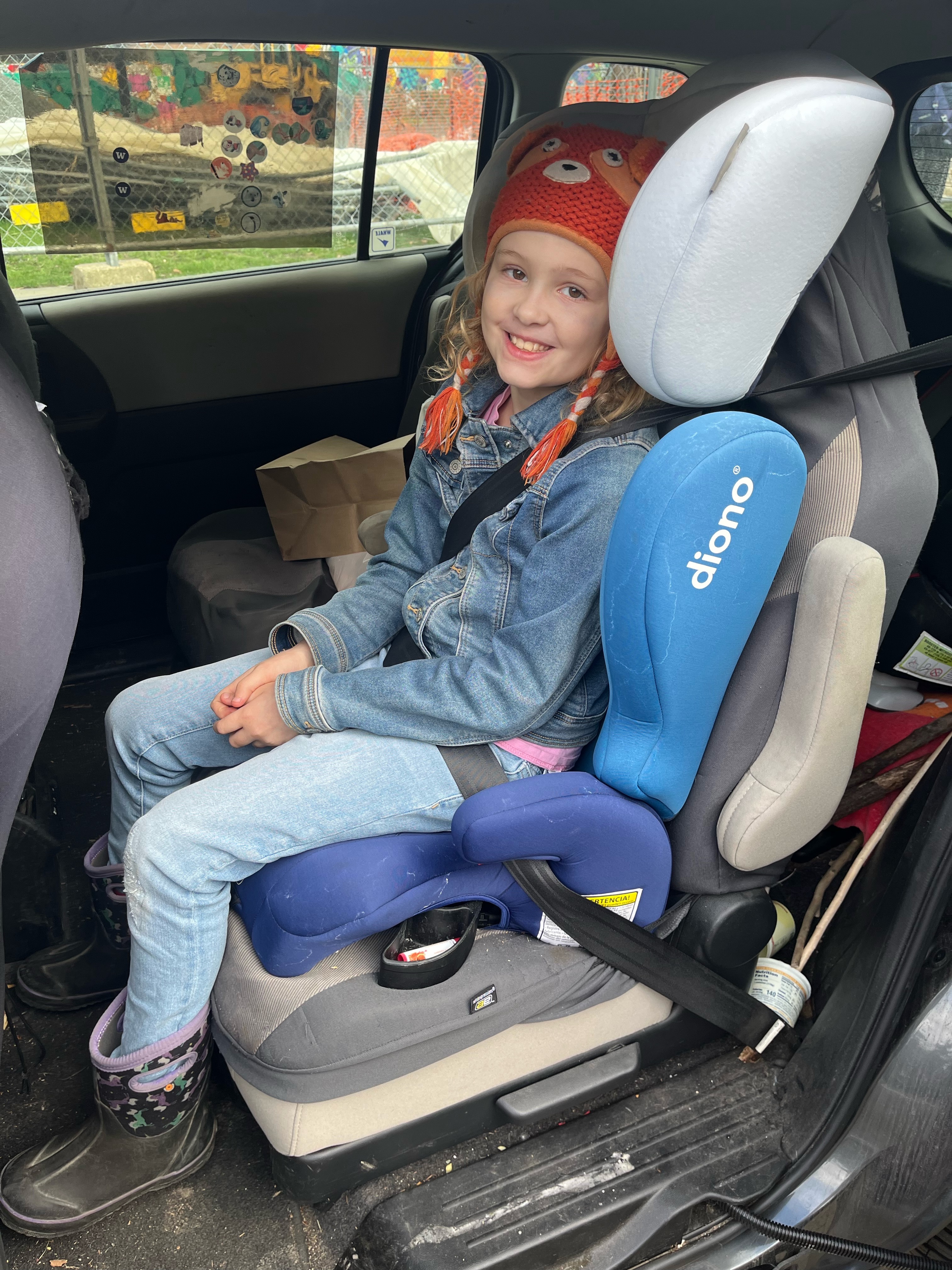 Diono Cambria 2 booster car seat with ten year old girl seated in vehicle