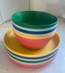 Target PIllowfort Plastic dishes for kids bowls and plates in six bright colors stacked together