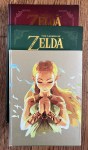 The Official Guide to Zelda, Art and Artifacts book and Hyrule Historia book in stack