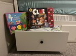 Hemnes convertible daybed with Ravensburger Four Games in One Box and Hasbro Clue Junior