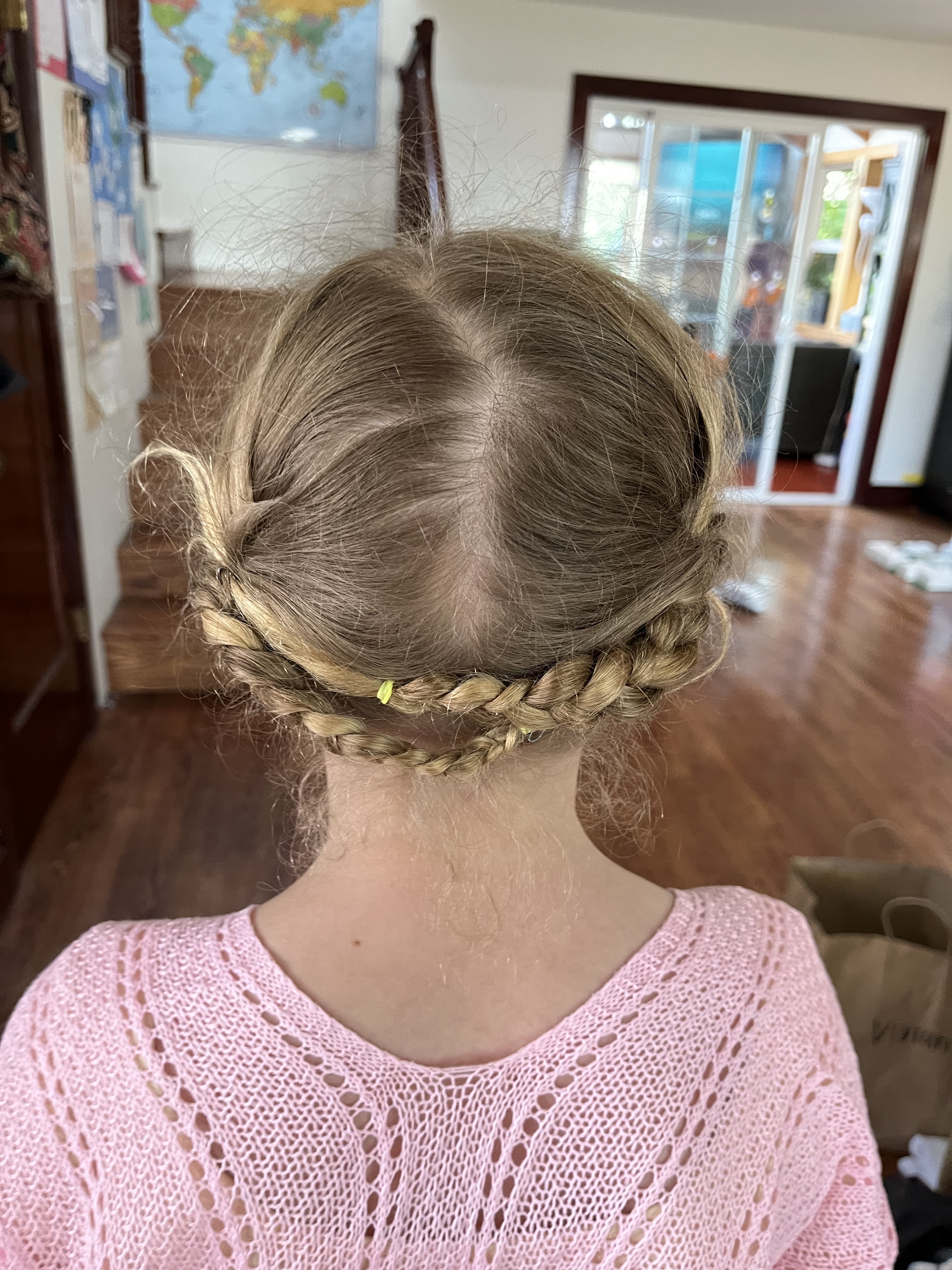 Eleven year old girl with hair in coronet braids wearing Soly Hux pale pink crochet beach cover up