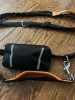 Lanney hands free dog leash with removable pouch in black with orange accents