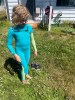 SeaSkin Kids Wetsuit in turquoise on eleven year old girl standning in
