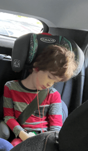 Seven year old sleeping in Graco TurboBooster booster car seat in Europe