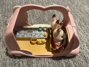 Calico Critter ice cream van with two bunny rabbits riding inside and