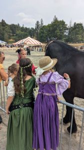 Girls wearing renaissance dresses with chemis