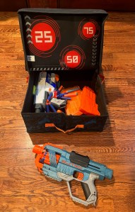 Nerf Battle Bunkr Combat Carrier Case with Nerf Elite blasteer next to it