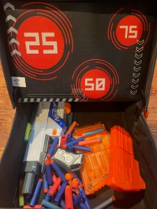 Nerf Bunkr Combat Carrying Case storage bin with Nerf guns, ammunition, and dart clips