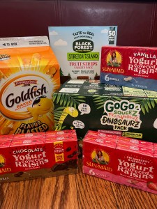 Goldfish cheese crackers, Black Forest fruit leather strips, Sun Maid yogurt raisins, and GoGo Squeez