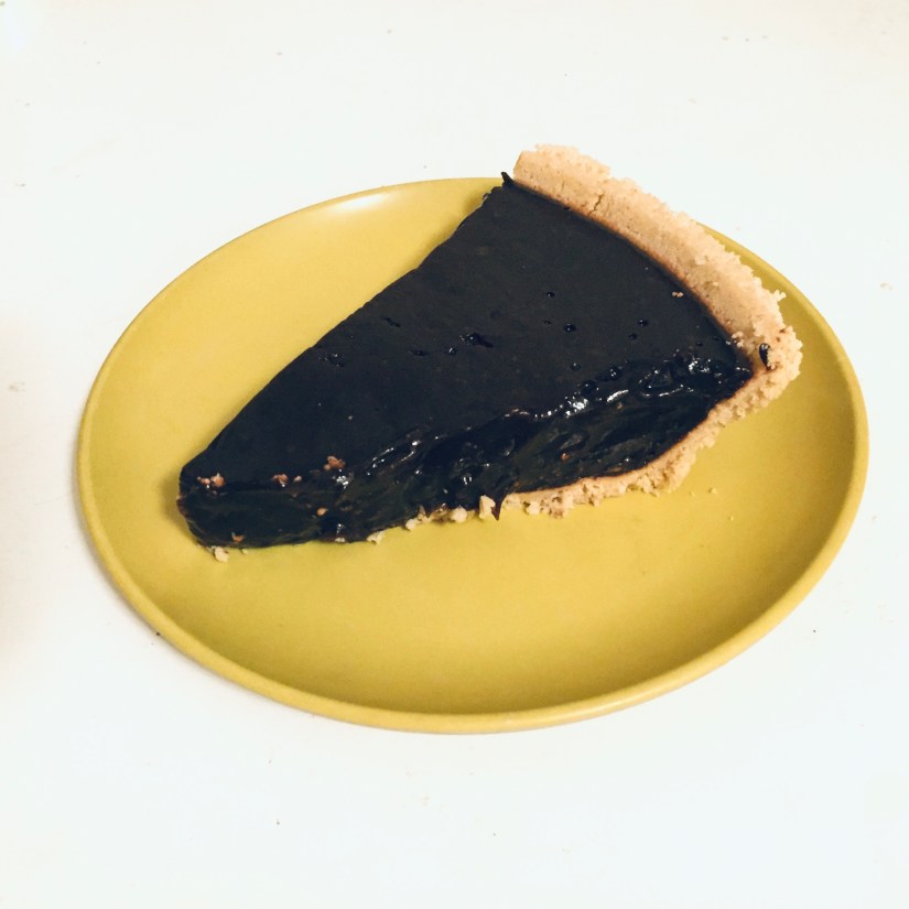 Chocolate pudding pie slice on yellow harvest gold plate