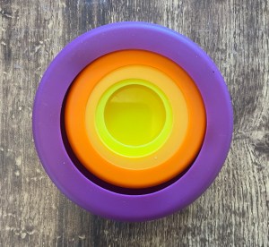 Food Huggers reusable silicone food savers nested in rainbow colors