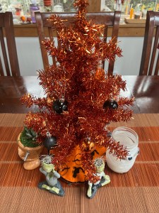 Halloween miniature orange tinsel tree decorated
