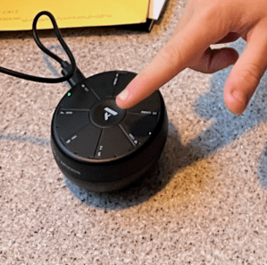 Teenager playing with Orba musical instrument