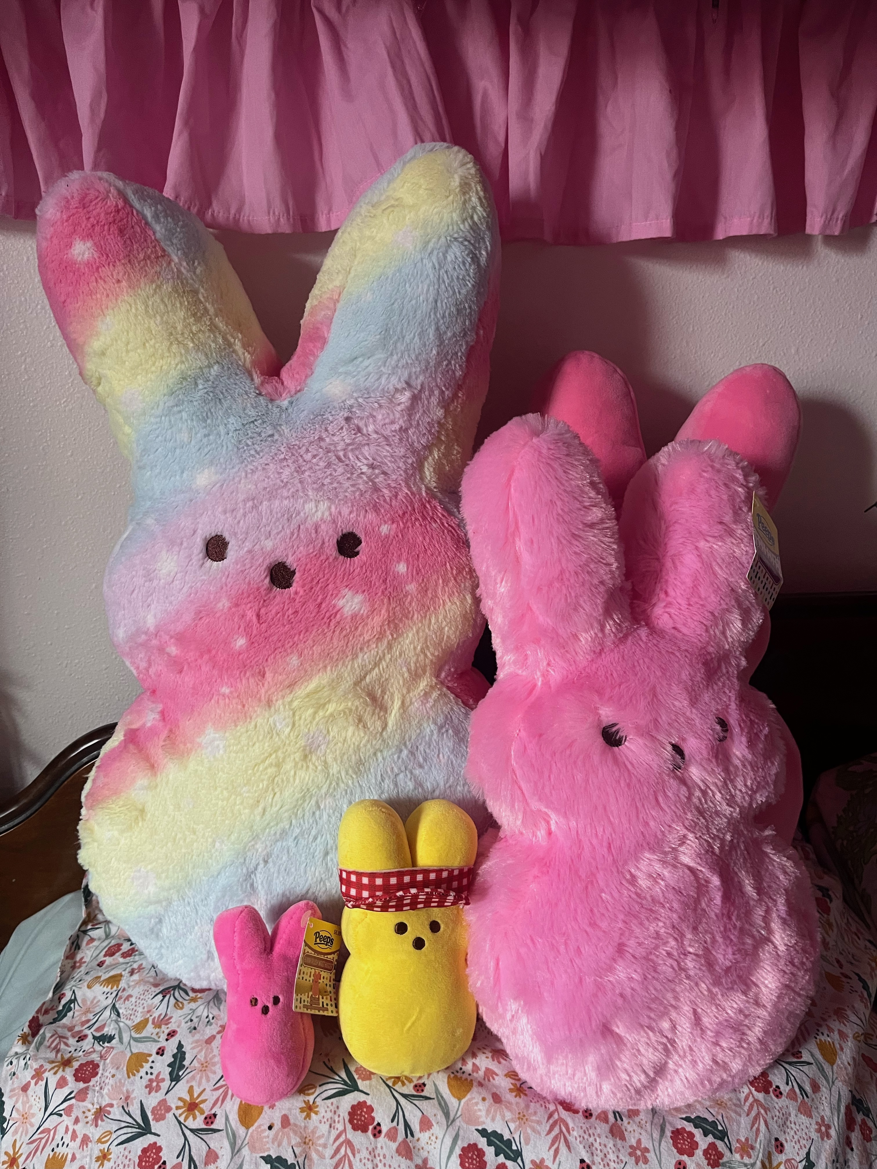 Peeps Easter bunny shaped stuffed animals on girl's bed in large rain