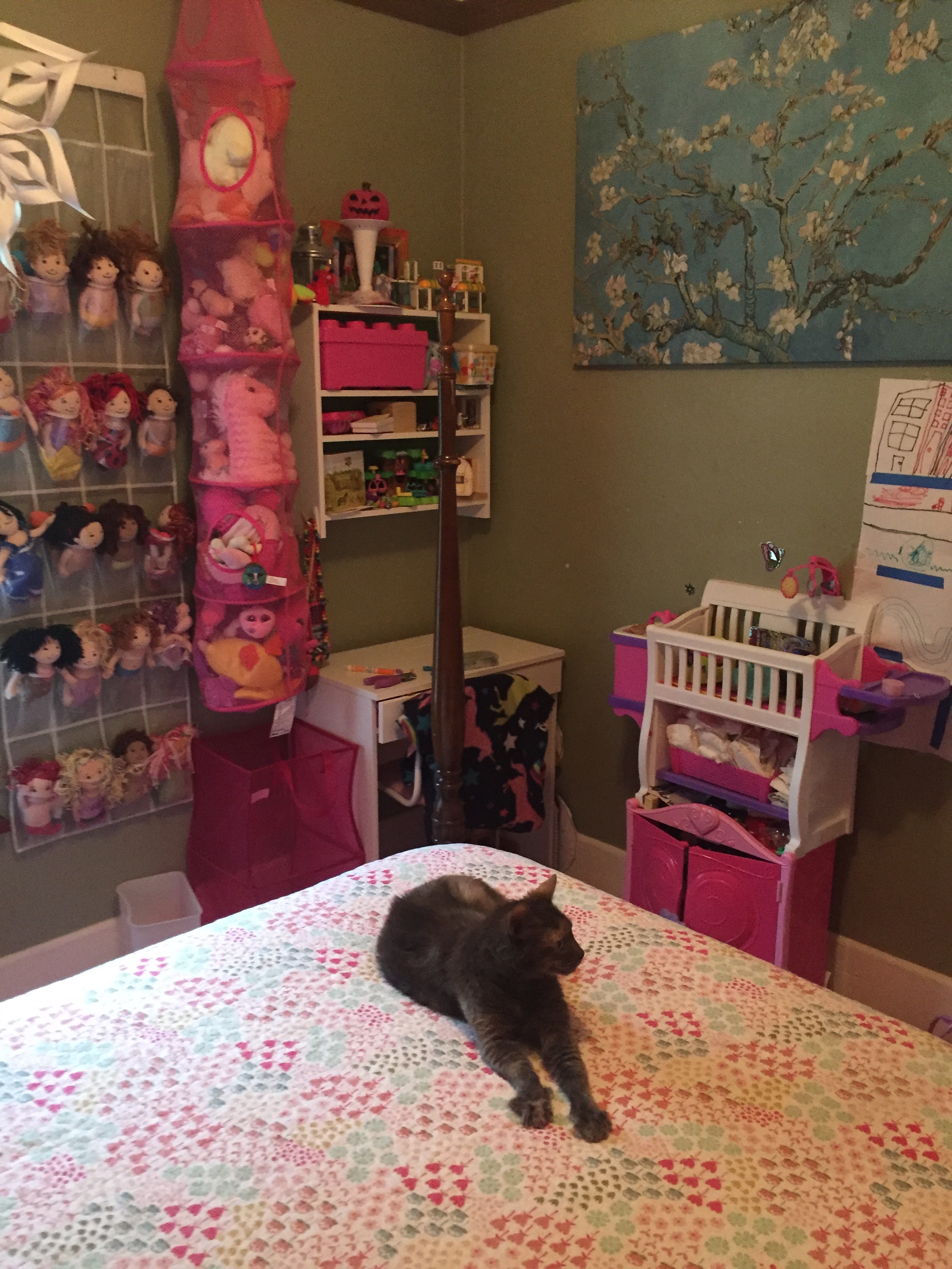 IKEA Brimnes dressing table as desk in corner of girl's bedroom with cat laying on bed