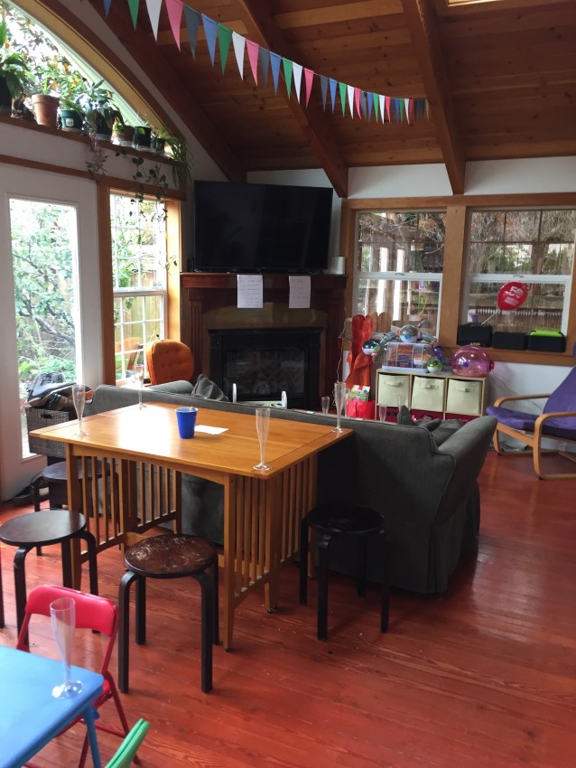 Flip Top folding console table set up behind sofa for party