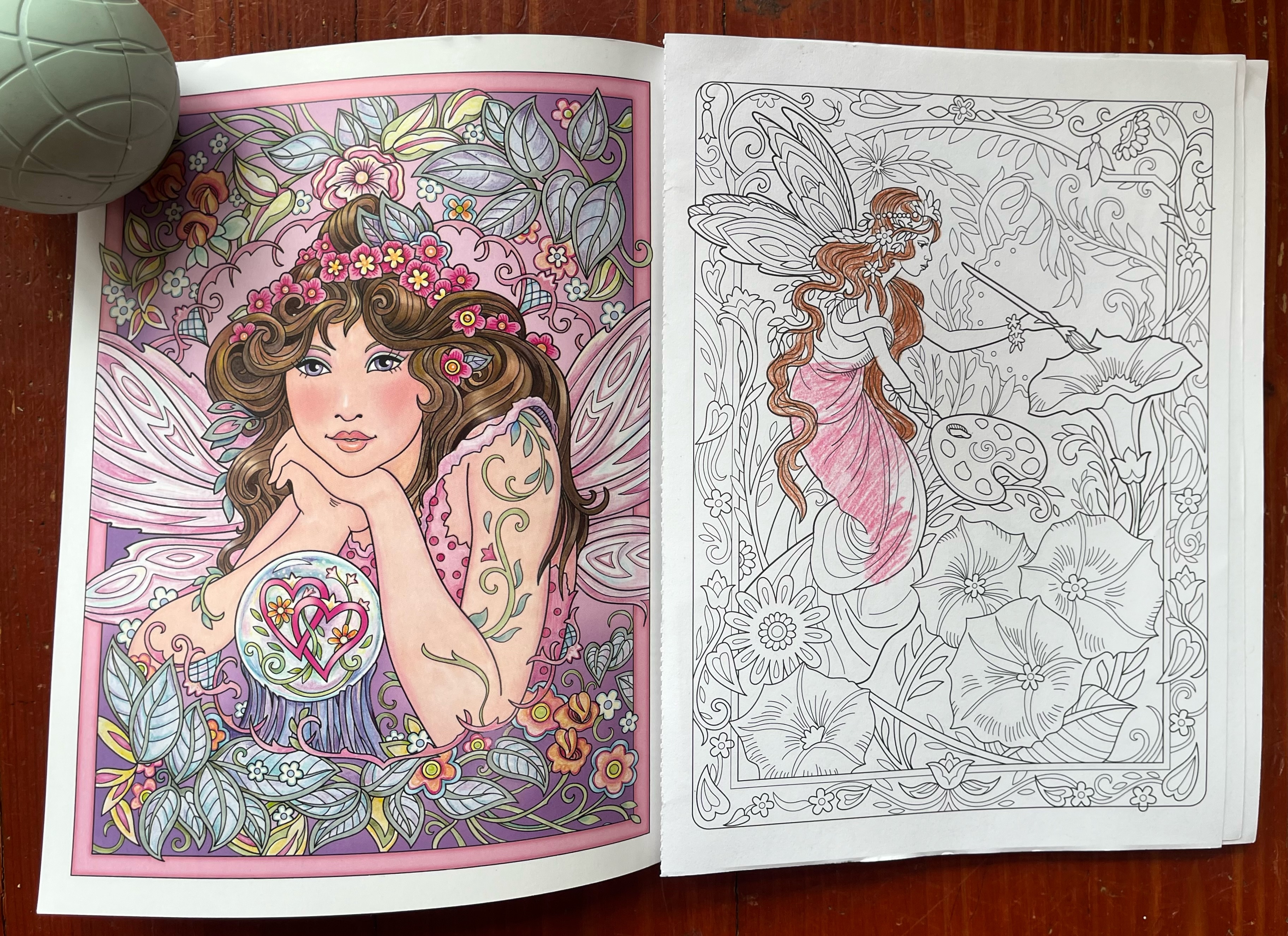 Creative Haven Magical Fairies Coloring Book front end page with partially colored