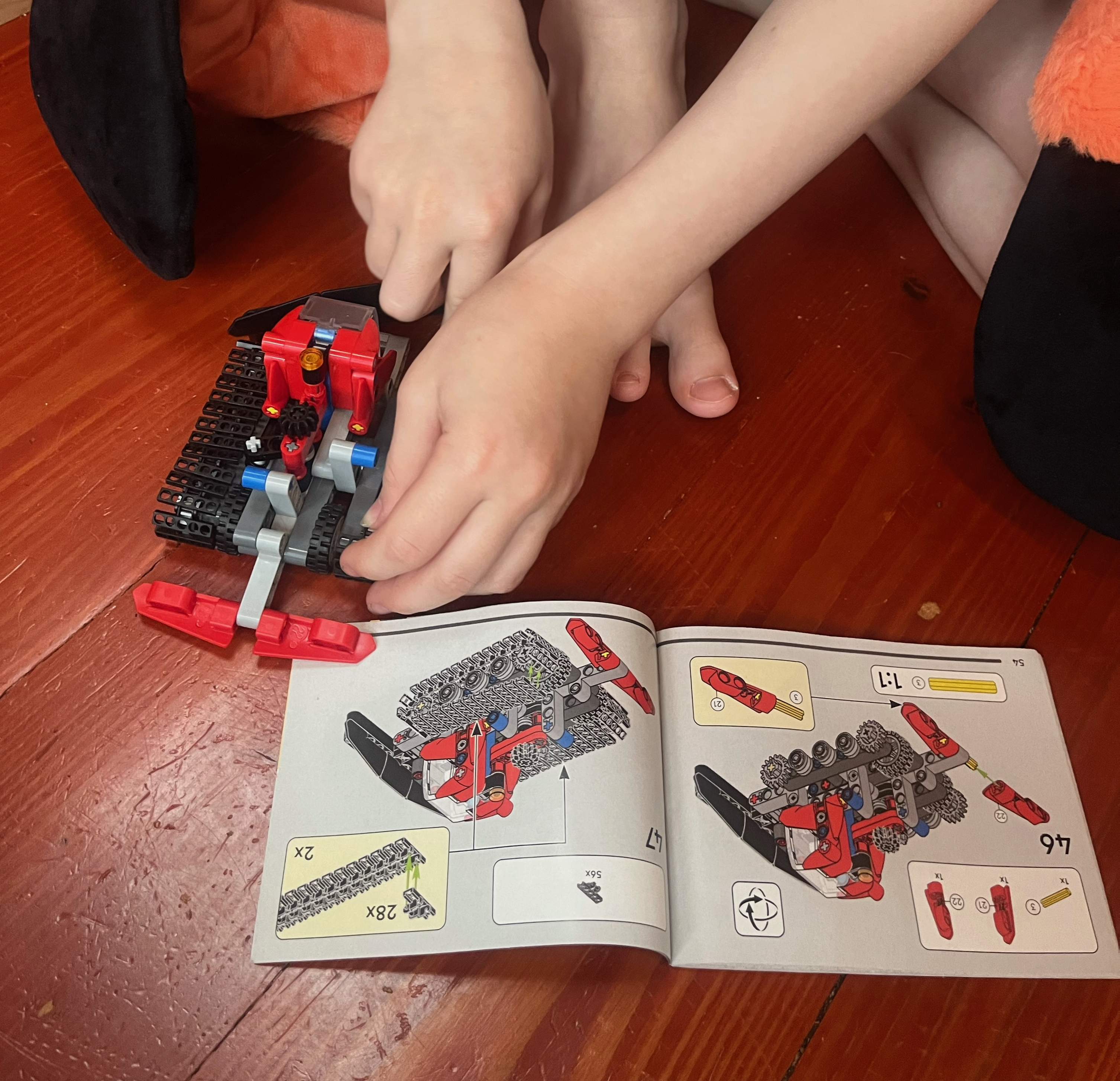 Nine year old child assembling LEGO